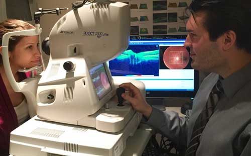 Dr. Scott Holbert performing an OCT scan